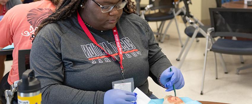 Student working on prosthetic. .